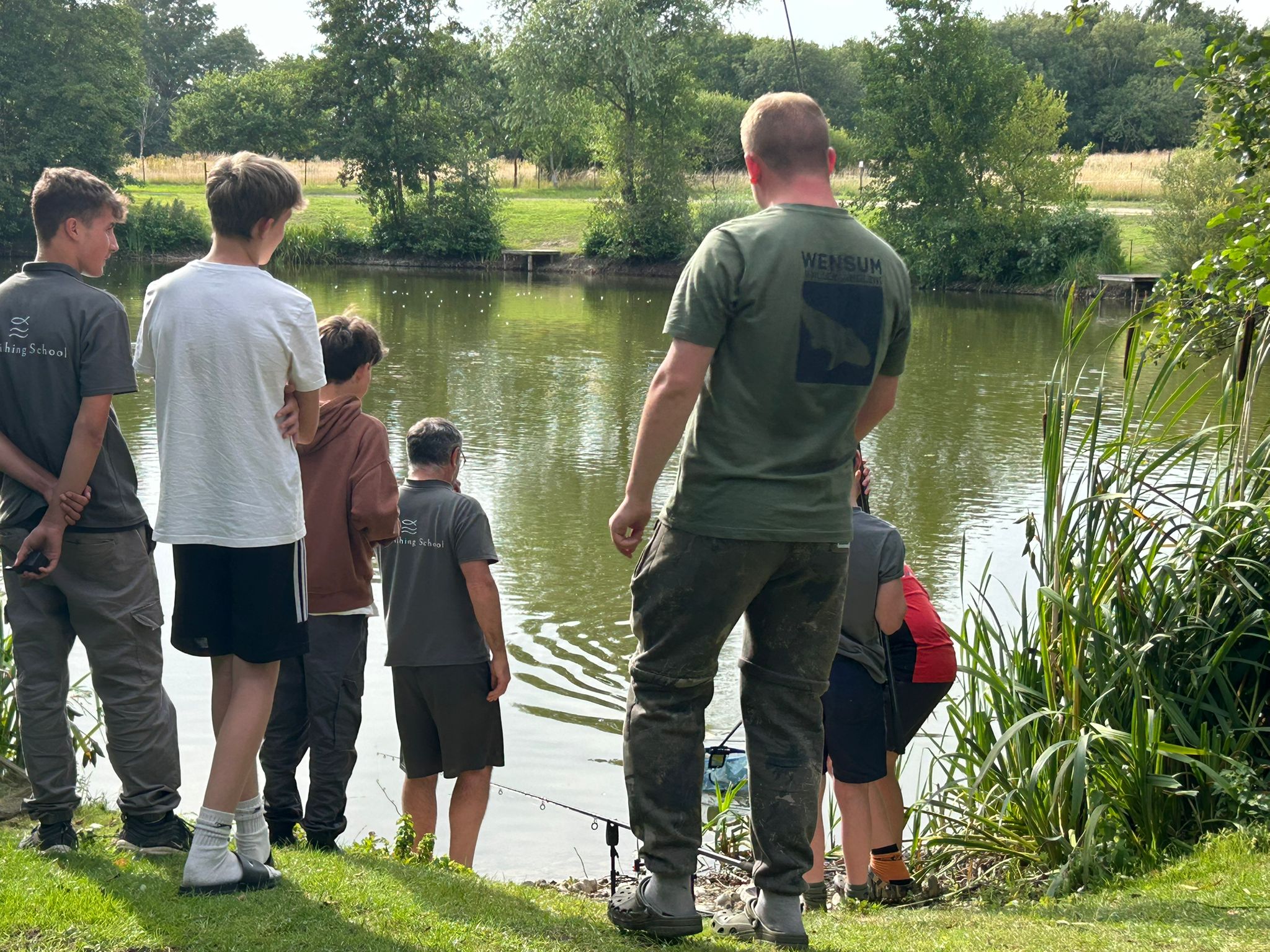 Children learning boilie making from KC Baits at a UK fishing school